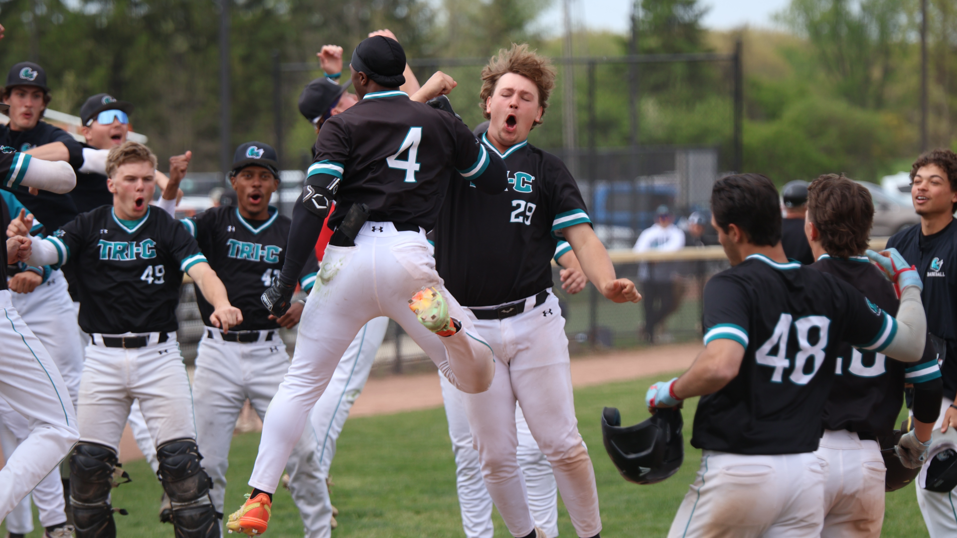 Players jumping and celebrating after a home run