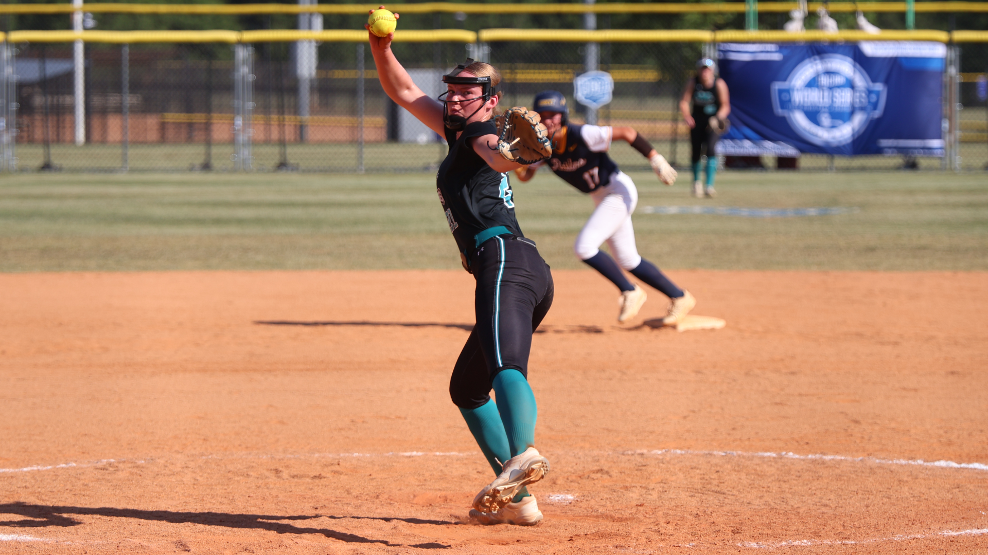 Softball player about to throw a pitch